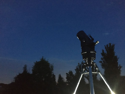 telescope with night sky in background